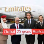 Emirates celebrates 25 years at Munich Airport: Joachim Sobottka-Rogalla, Emirates Airport Services Manager Munich (left), and Oliver Dersch, Senior Vice President Aviation, Munich Airport - flanked by members of the Emirates cabin crew.